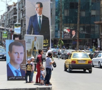 ملصقات في دمشق للرئيس بشار الأسد قبل الانتخابات الرئاسية في أيار/ مايو.