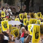 R4bia_sign_used_in_solidarity_with_victims_of_Rabaa_crackdown_23-Aug-2013