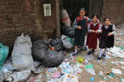 Egyptian-schoolgirls-walk-past-trash-bags-and-litter-in-the-impoverished-Al-Zabbalin-area-in-Al-Mukatam-neighborhood-in-Cairo-on-April-202010photoKhaled-DesoukiAFPGetty-Images