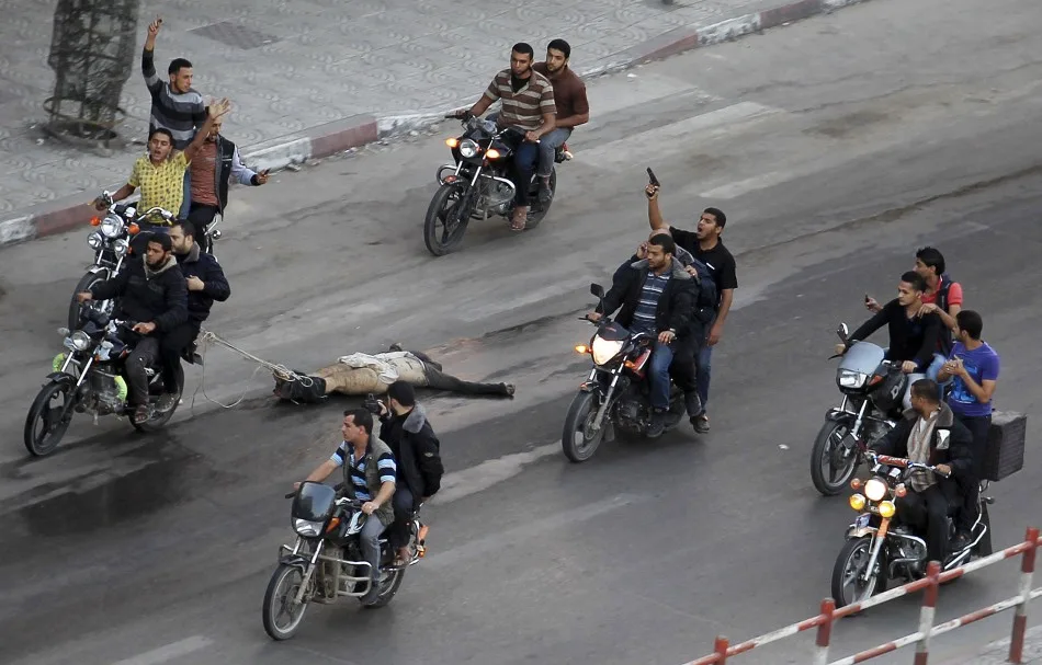 palestinian-gunmen-ride-motorcycles-they-drag-body-man-who-was-suspected-working-israel