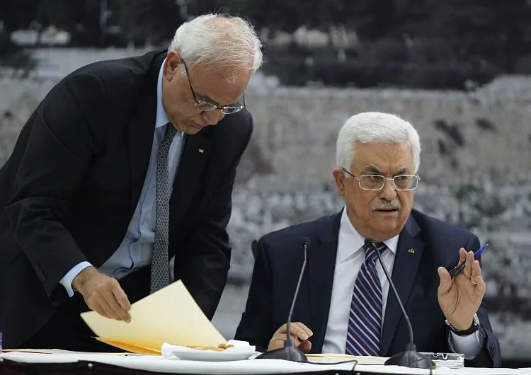 Abbas-signs-a-request-to-join-15-United-Nations-agencies-at-his-headquarters-in-the-West-Bank-city-of-Ramallah-on-April-1-Abbas-Momani-AFP-Getty-Images_opt