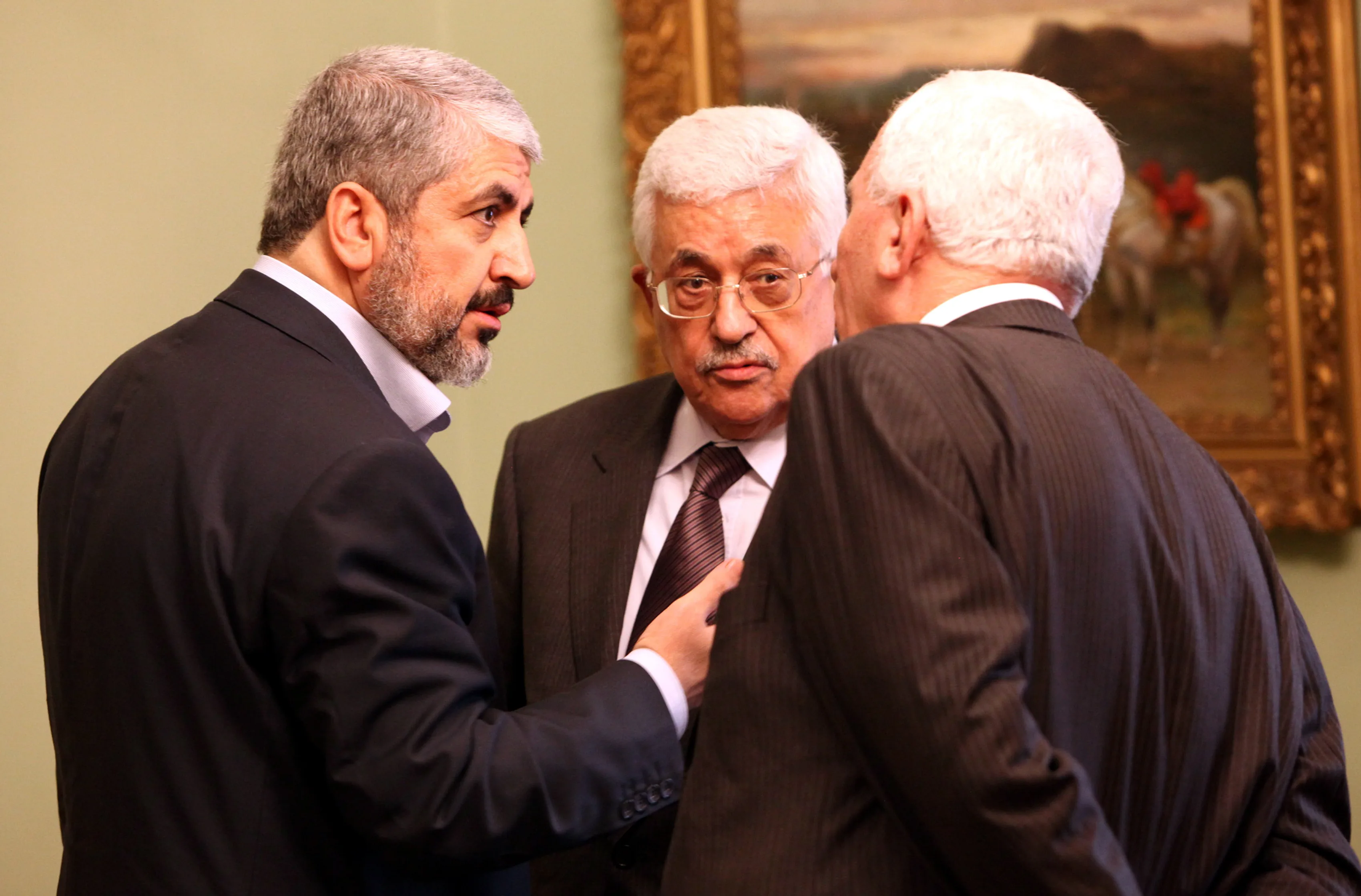 Palestinian-President-Mahmoud-Abbas-C-with-Hamas-leader-Khaled-Meshaal-L-and-Fatah-negotiator-Azzam-al-Ahmed-R