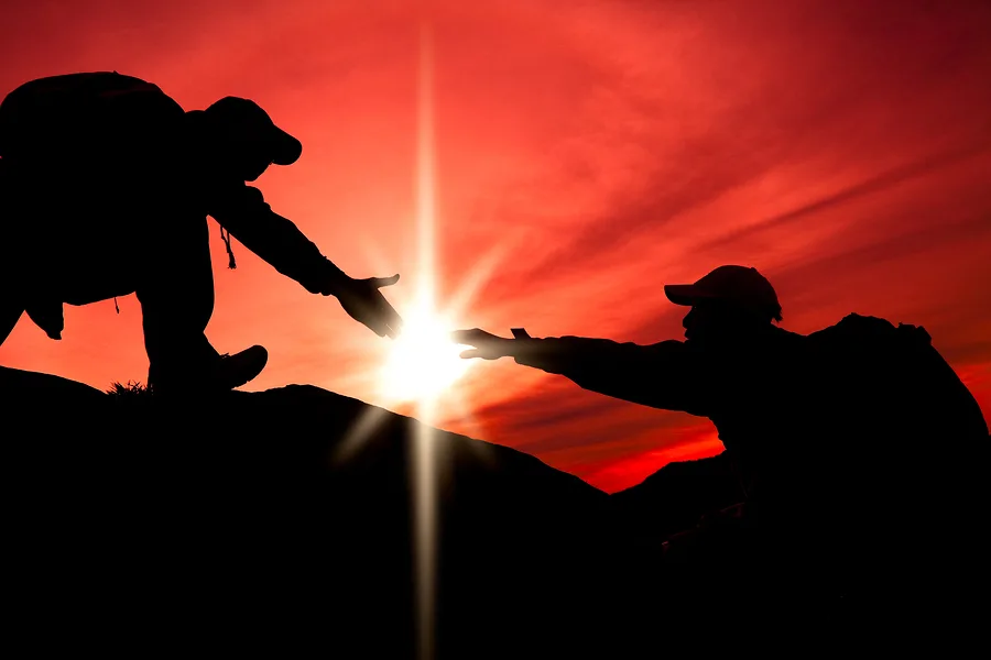 bigstock-silhouette-of-helping-hand-bet-35213948