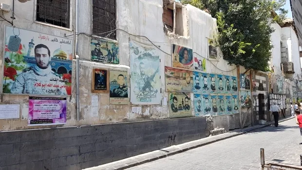 a_wall_in_old_damascus_with_pictures_of_dead_men_and_victims