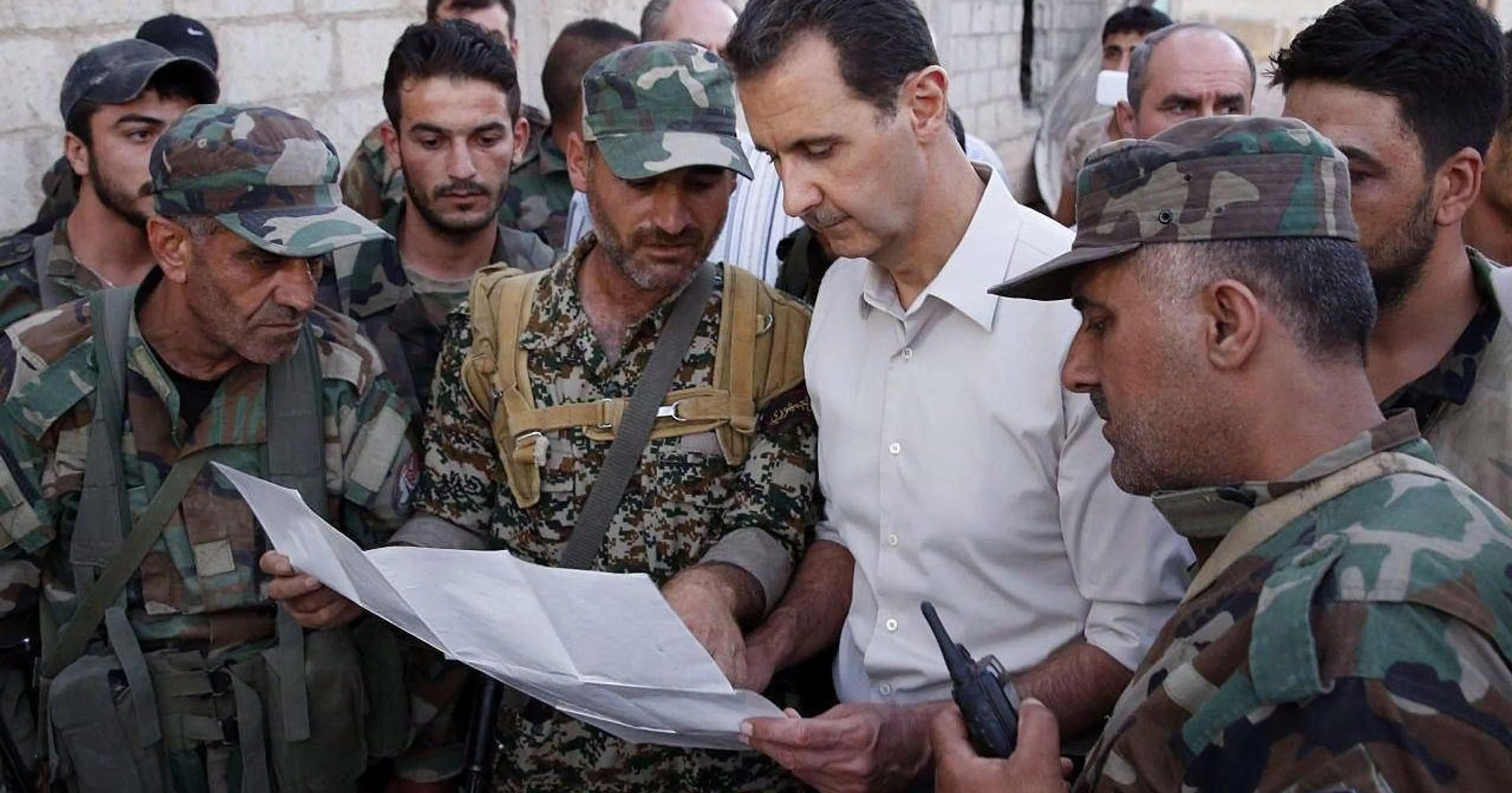 636113637690911792-assad-with-troops