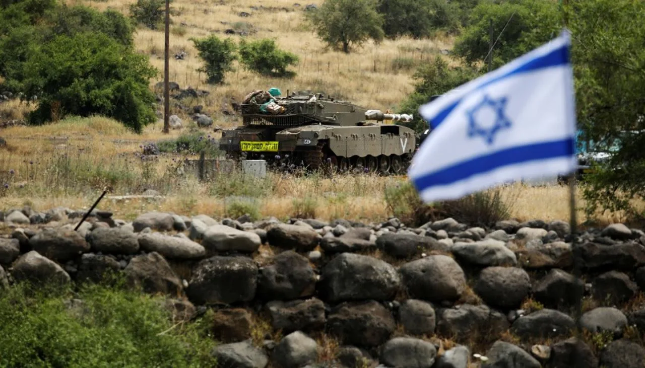 rts1qlrz-an-israeli-tank-can-be-seen-near-the-israeli-side-of-the-border-with-syria-in-the-israeli-occupied-golan-heights-1120
