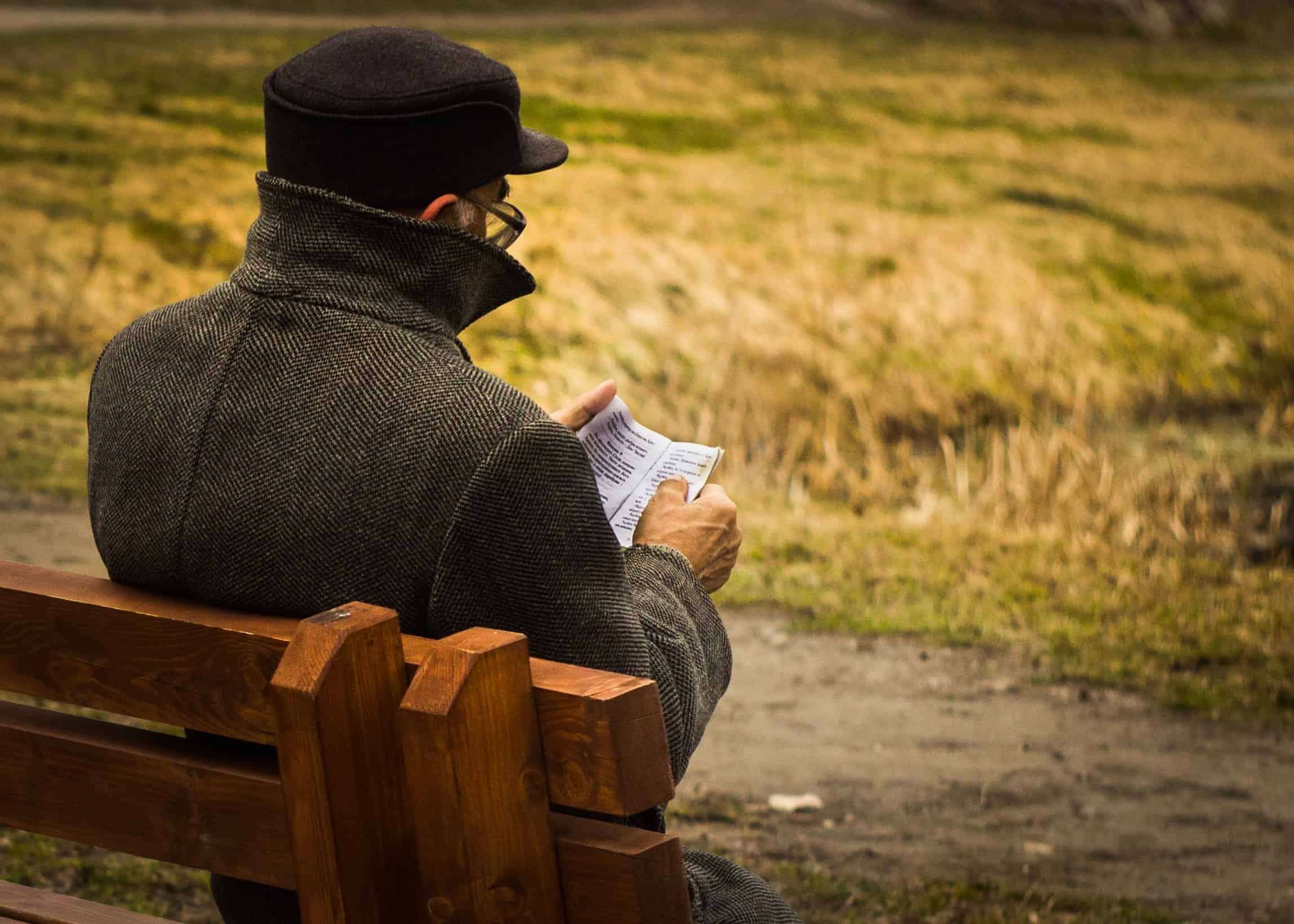 man-reading-outdoors