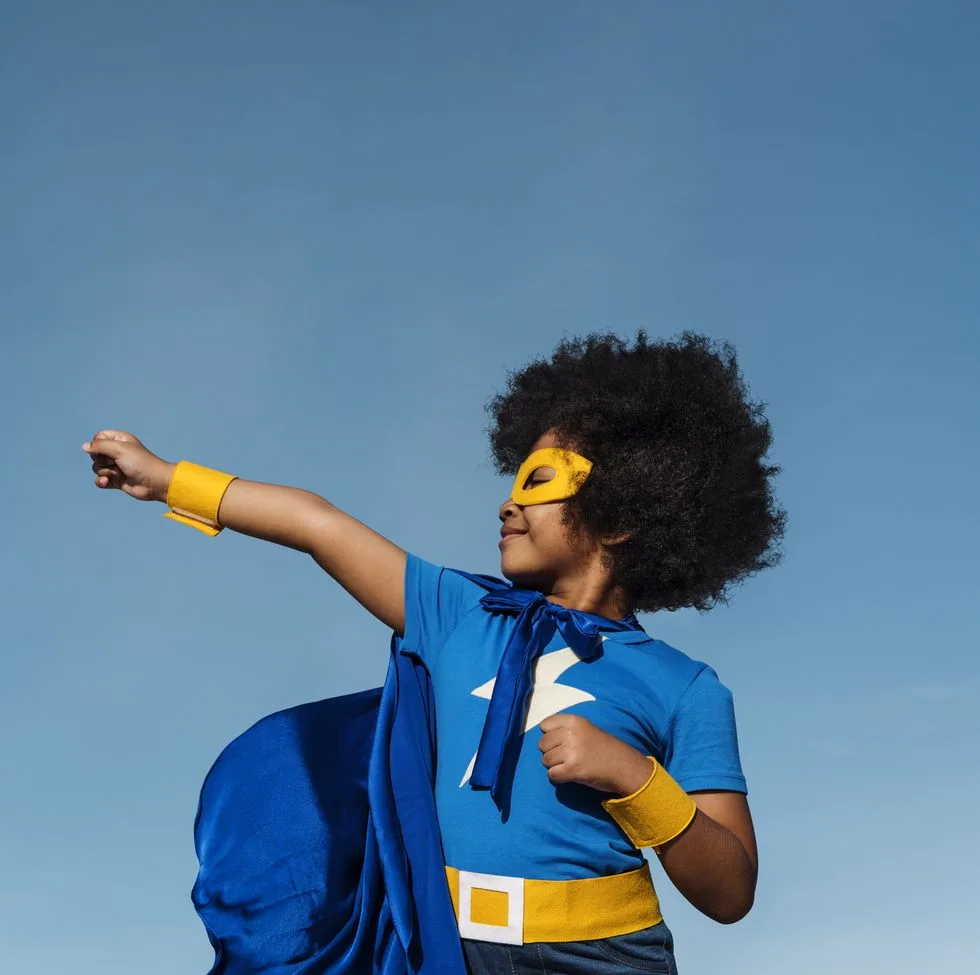 girl-with-afro-playing-superhero-royalty-free-image-1655414707